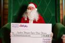 Santa is ready to hand out the money in the Christmas draw